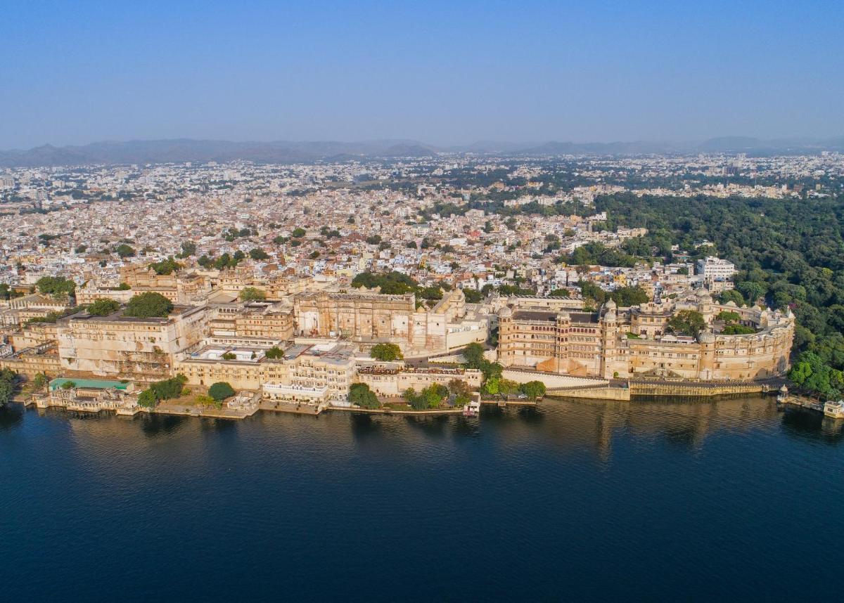 an aerial view of a city on the water at Shiv Niwas Palace by HRH Group of Hotels in Udaipur