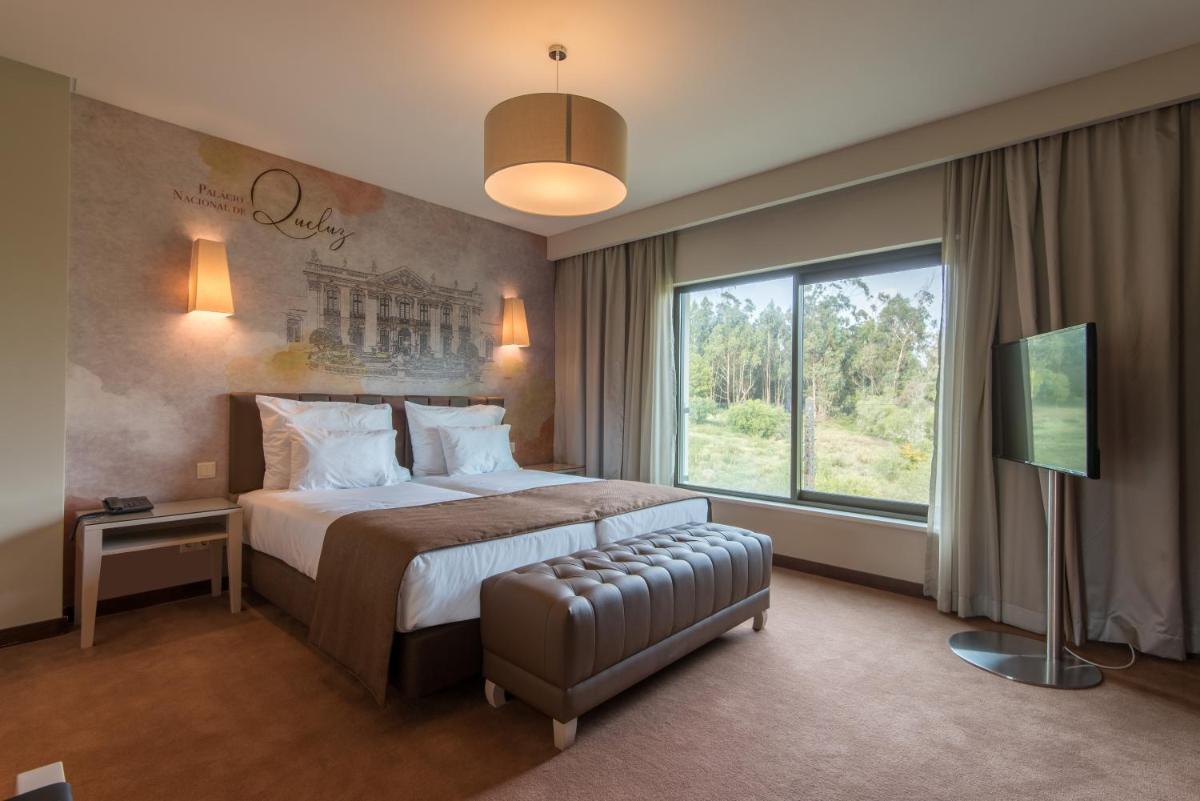 Uma cama ou camas num quarto em Vila Gale Sintra
