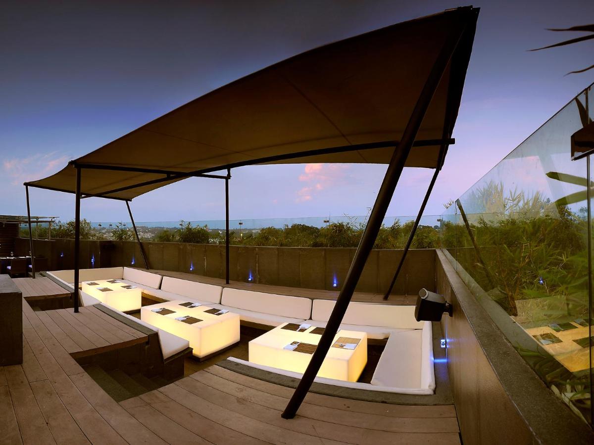 a large umbrella on top of a roof at The Lalit Ashok in Bengaluru a large umbrella on top of a roof at The Lalit Ashok in Bengaluru