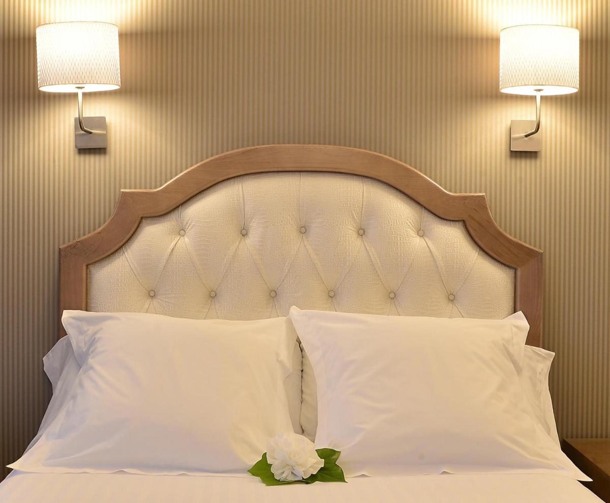 Cama o camas de una habitación en Beatriz Toledo Auditorium & Spa