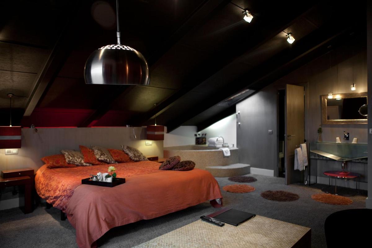 Cama o camas de una habitación en Hotel Cardamomo Sigüenza
