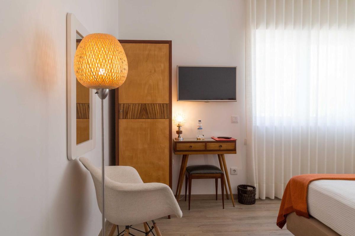 Uma cama ou camas num quarto em Aires da Serra Hotel