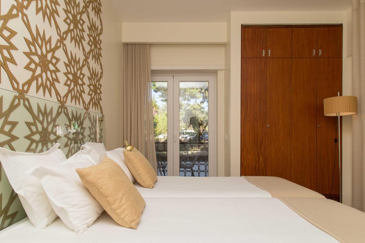 Uma cama ou camas num quarto em Aires da Serra Hotel
