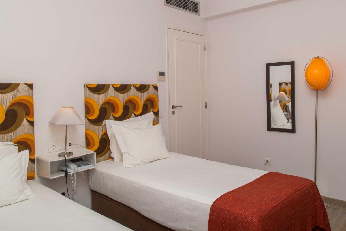 Uma cama ou camas num quarto em Aires da Serra Hotel