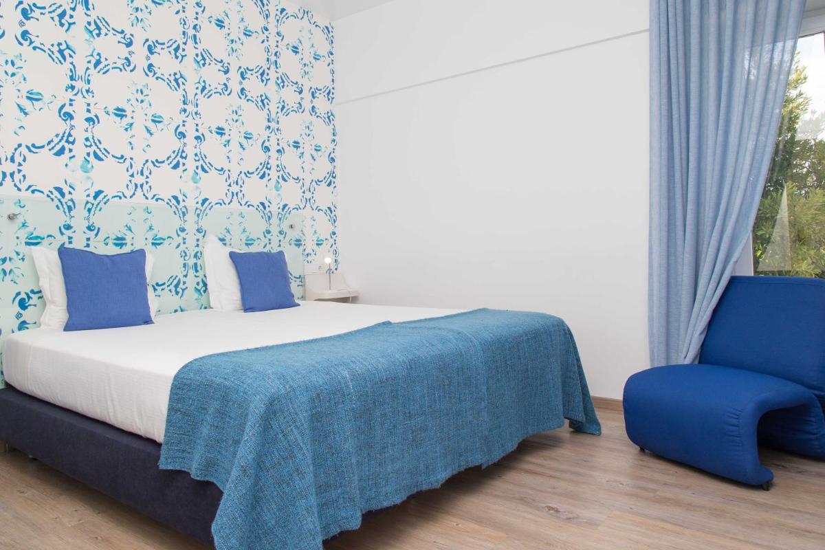 Uma cama ou camas num quarto em Aires da Serra Hotel