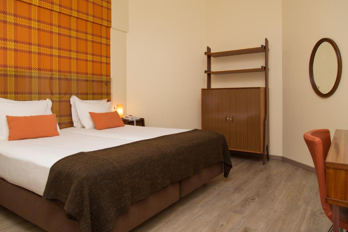 Uma cama ou camas num quarto em Aires da Serra Hotel