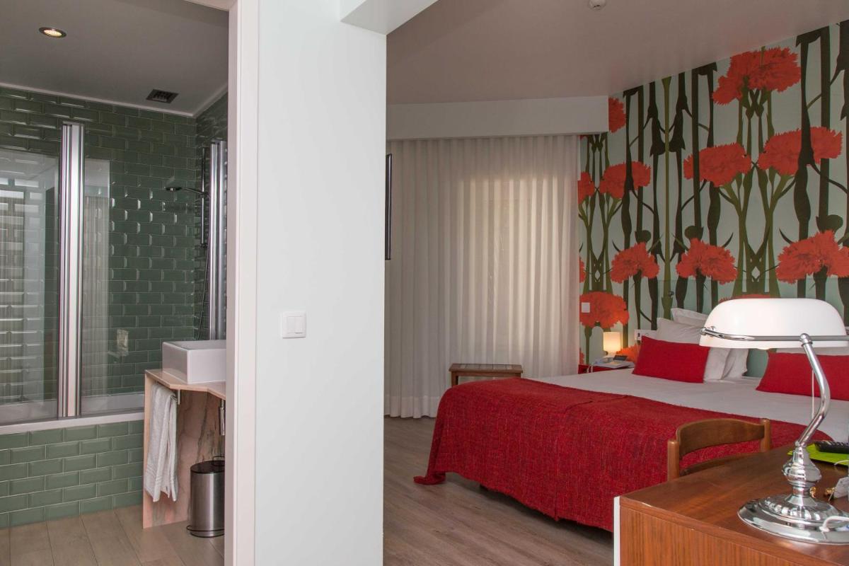 Uma cama ou camas num quarto em Aires da Serra Hotel