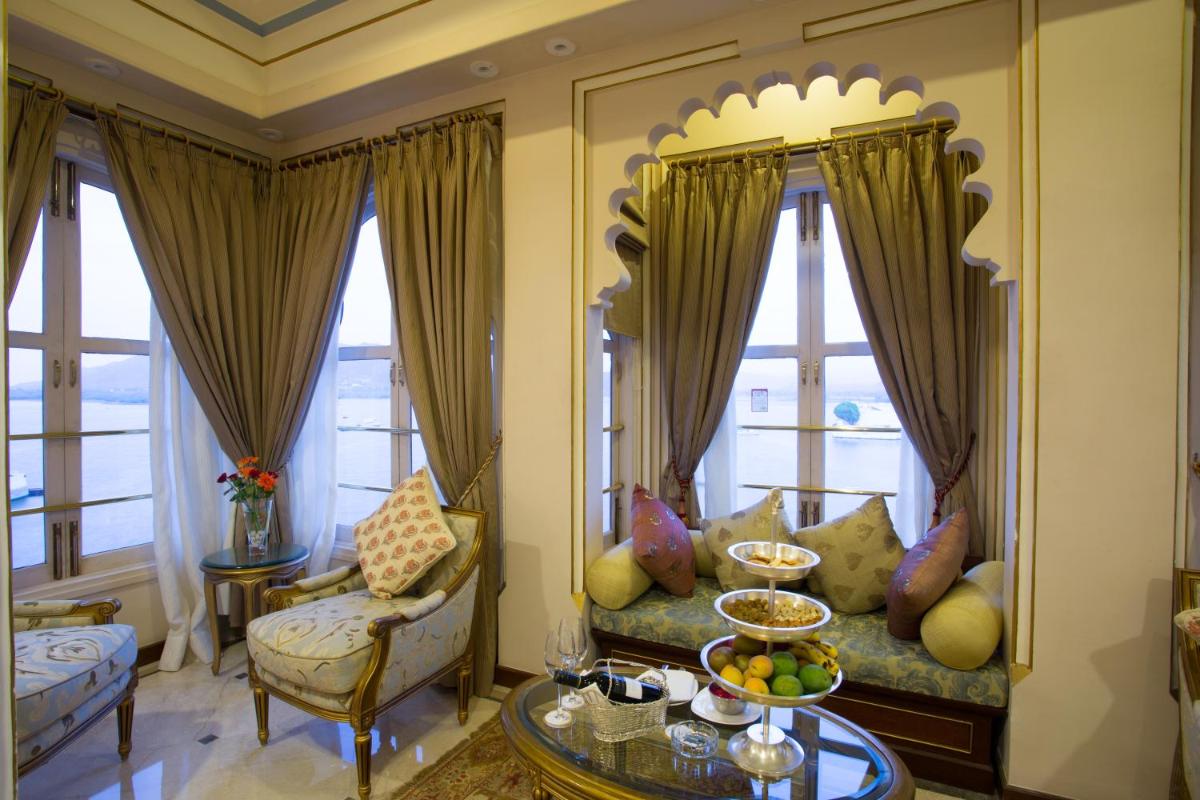 a living room with a couch and a table at Taj Fateh Prakash Palace Udaipur in Udaipur