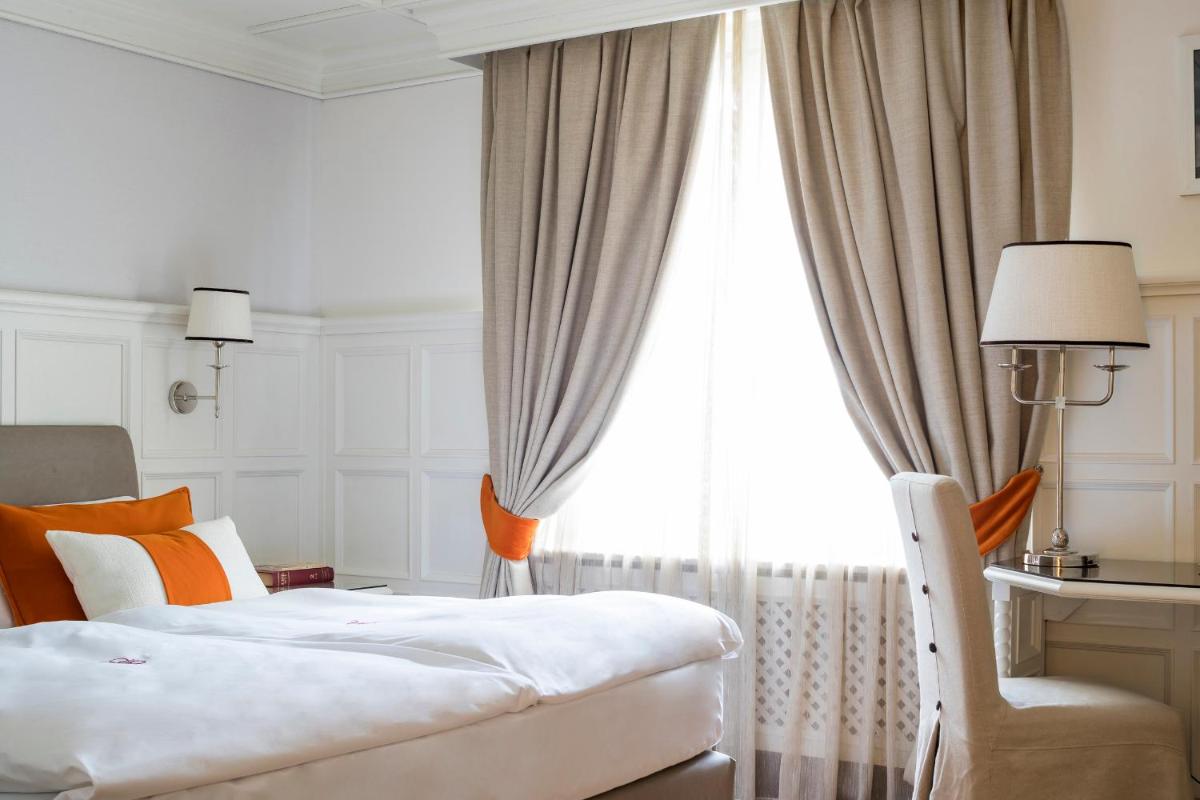 Un ou plusieurs lits dans un hébergement de l'établissement Grand Hôtel des Alpes