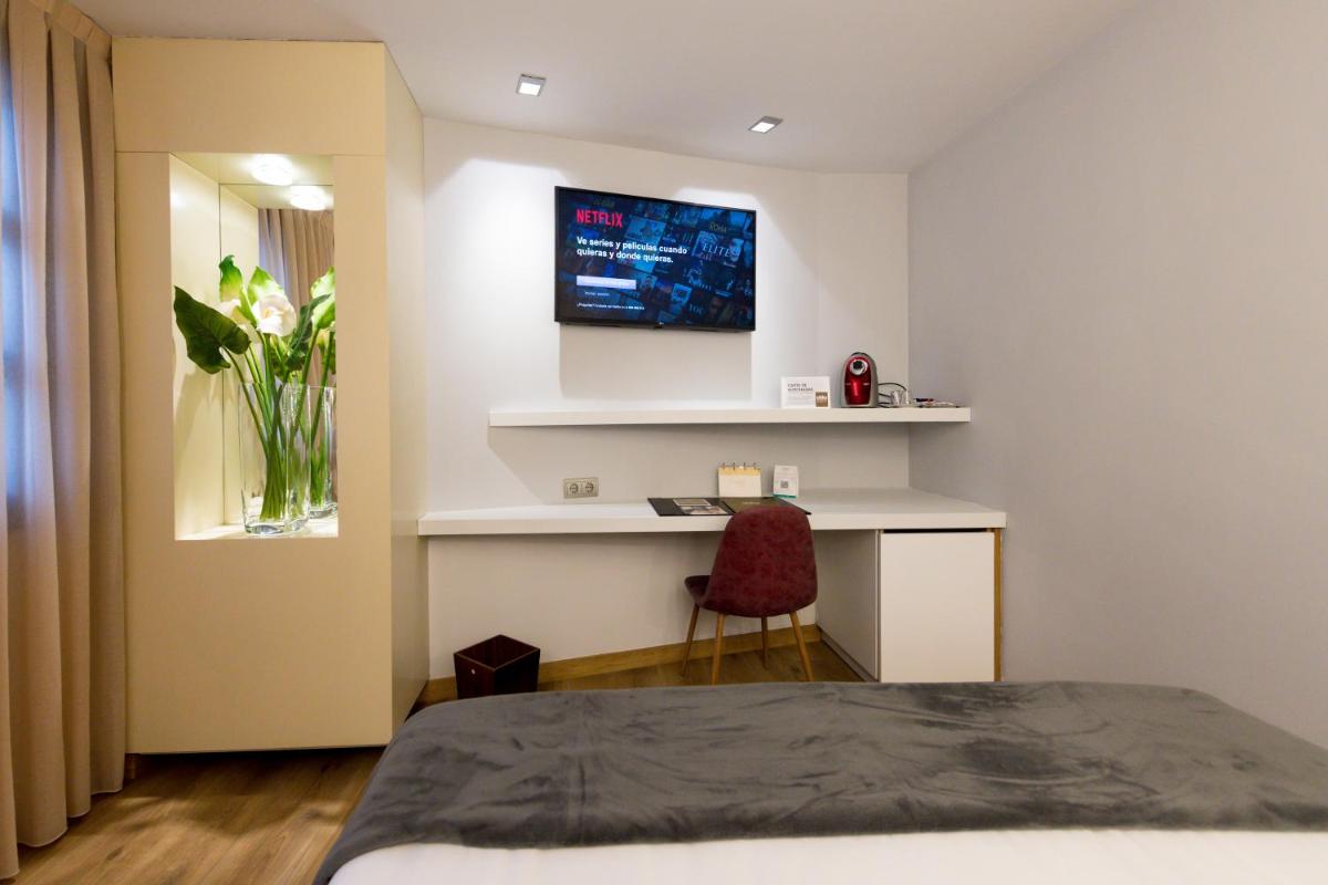 Cama o camas de una habitación en Hotel Fruela