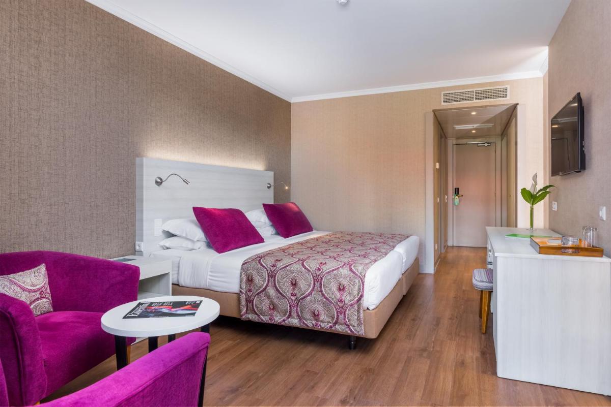 Uma cama ou camas num quarto em Enotel Lido - All Inclusive