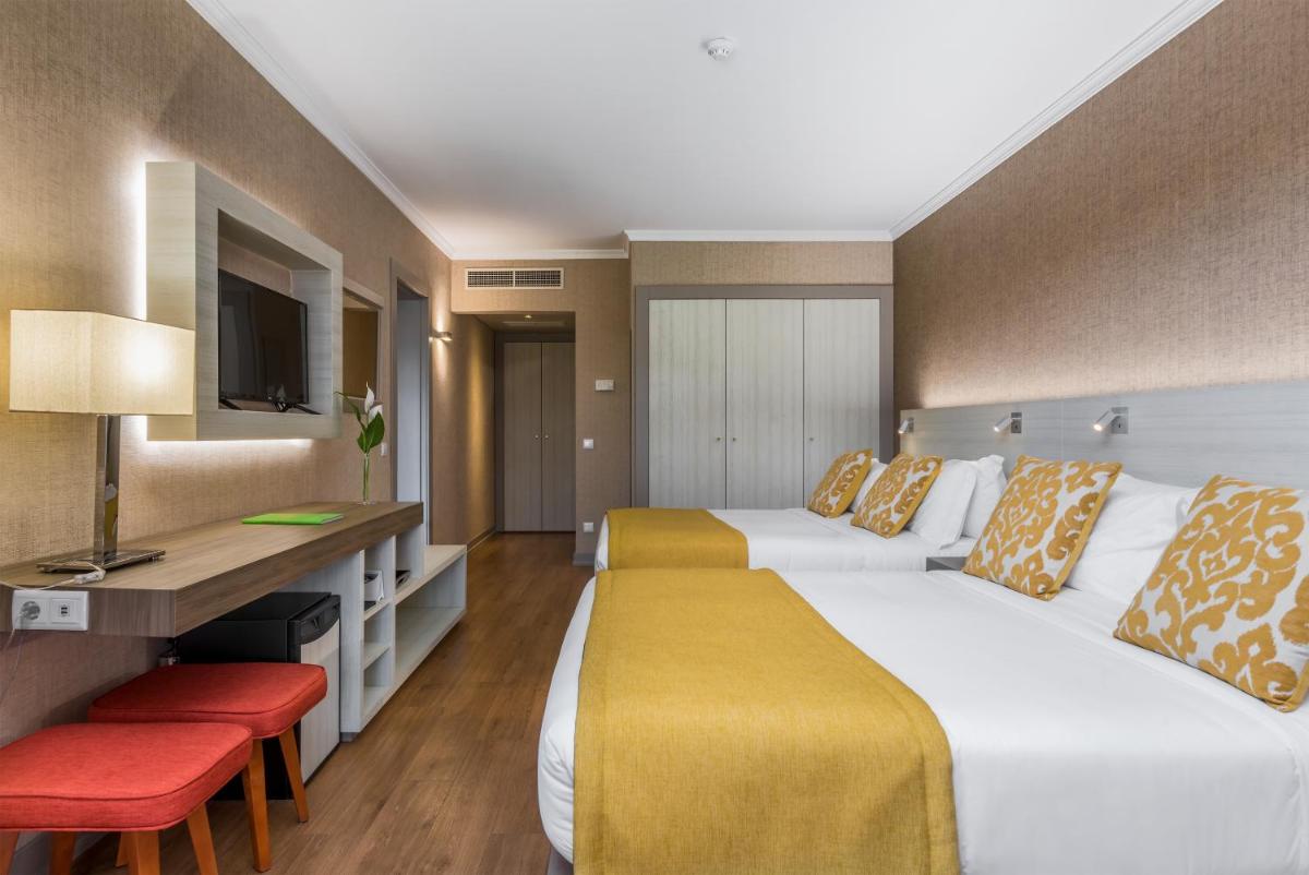 Uma cama ou camas num quarto em Enotel Lido - All Inclusive