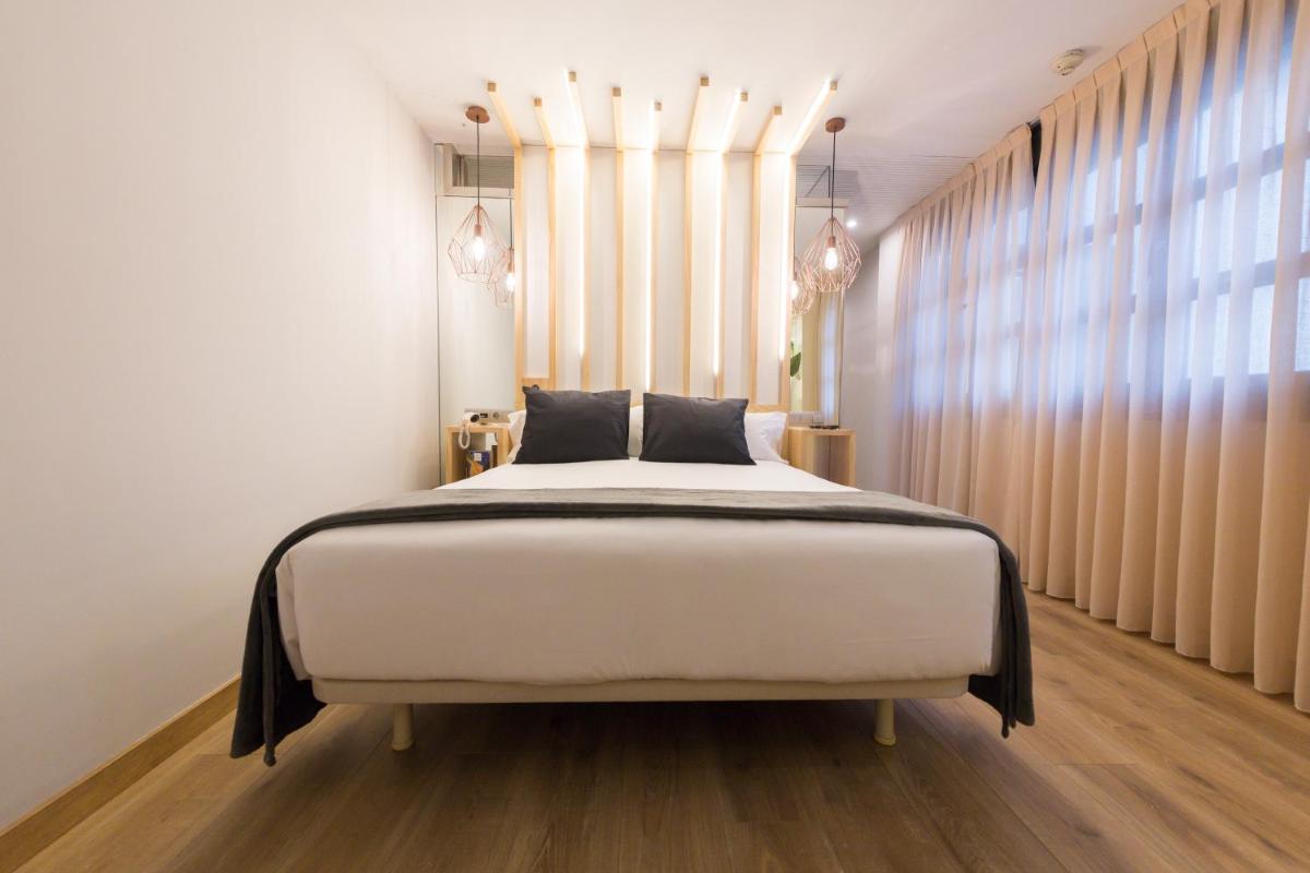 Cama o camas de una habitación en Hotel Fruela