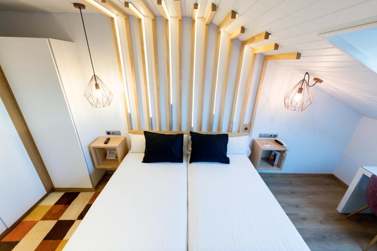 Cama o camas de una habitación en Hotel Fruela