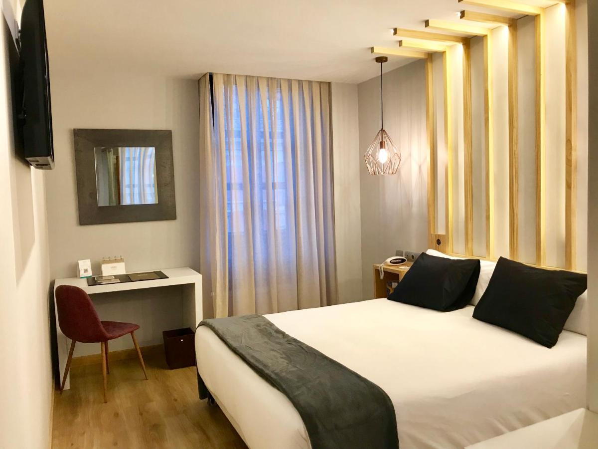 Cama o camas de una habitación en Hotel Fruela