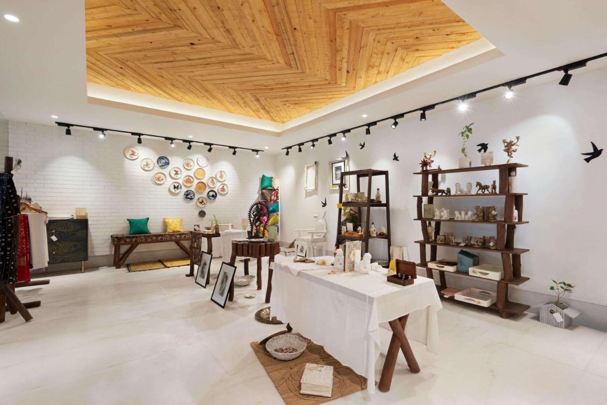 a store with tables and chairs in a room at Ramada by Wyndham Lucknow Hotel and Convention Center in Lucknow
