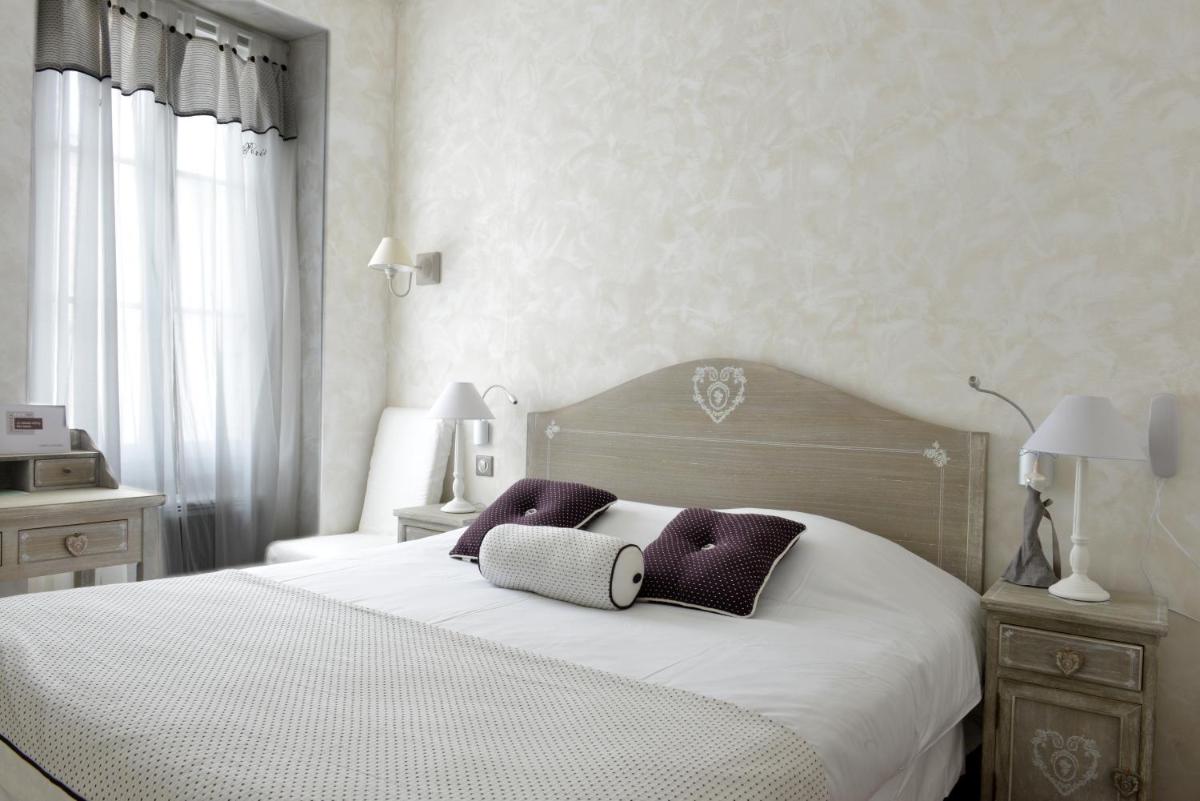 Un ou plusieurs lits dans un hébergement de l'établissement Grand Hôtel des Bains SPA