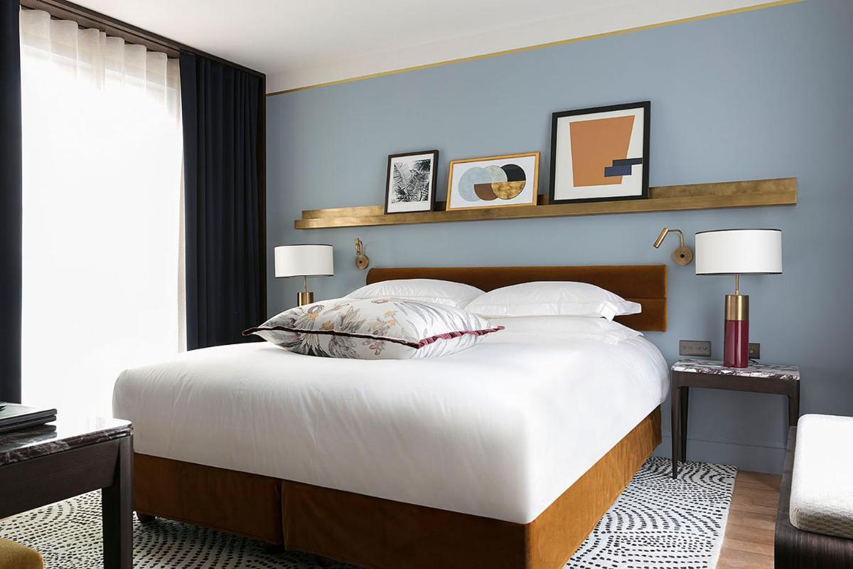 Un ou plusieurs lits dans un hébergement de l'établissement Les Jardins du Faubourg Hotel & Spa by Shiseido
