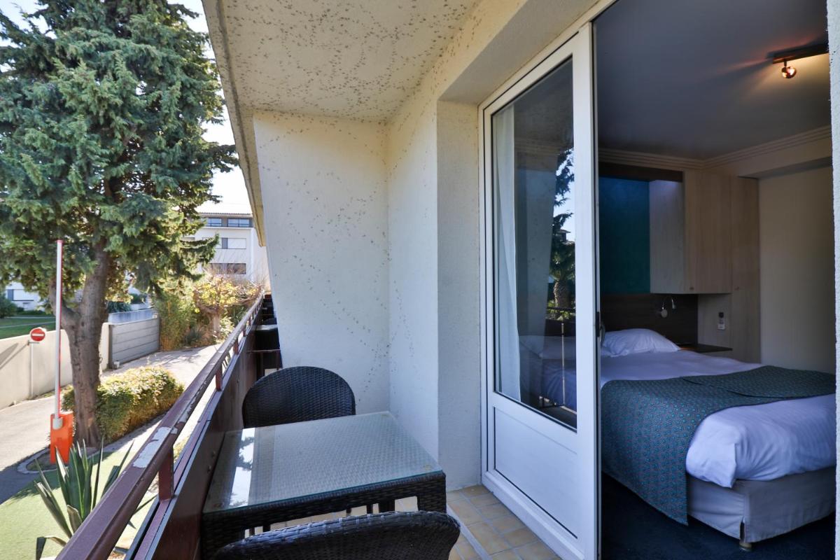 Un ou plusieurs lits dans un hébergement de l'établissement Hotel SPA Plage St Jean