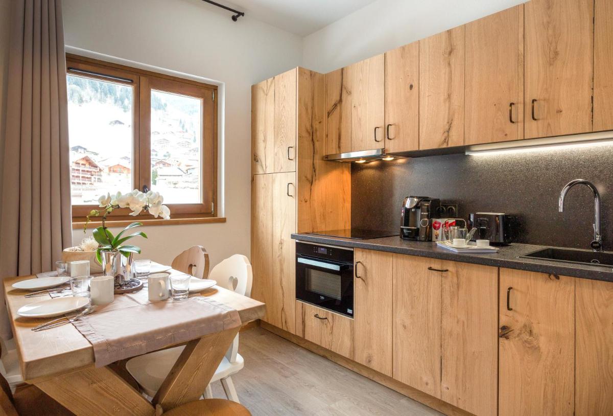 Cuisine ou kitchenette dans l'établissement Résidence Club MMV La Clé des Cimes