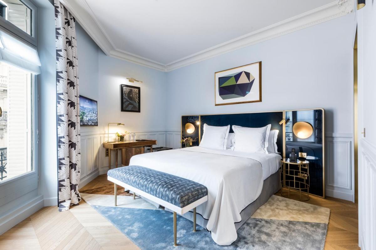 Un ou plusieurs lits dans un hébergement de l'établissement Grand Powers Hotel
