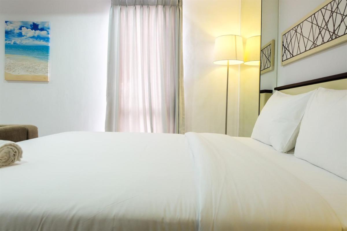 Studio Room Azalea Suites Apartment By Travelio - Housity