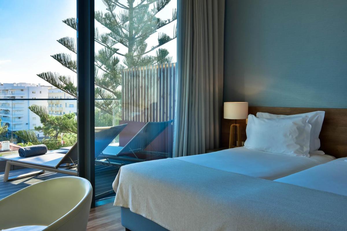 Uma cama ou camas num quarto em The Prime Energize Hotel & SPA - Algarve