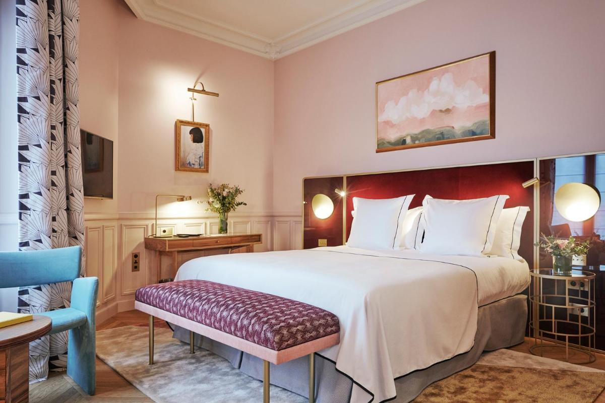 Un ou plusieurs lits dans un hébergement de l'établissement Grand Powers Hotel