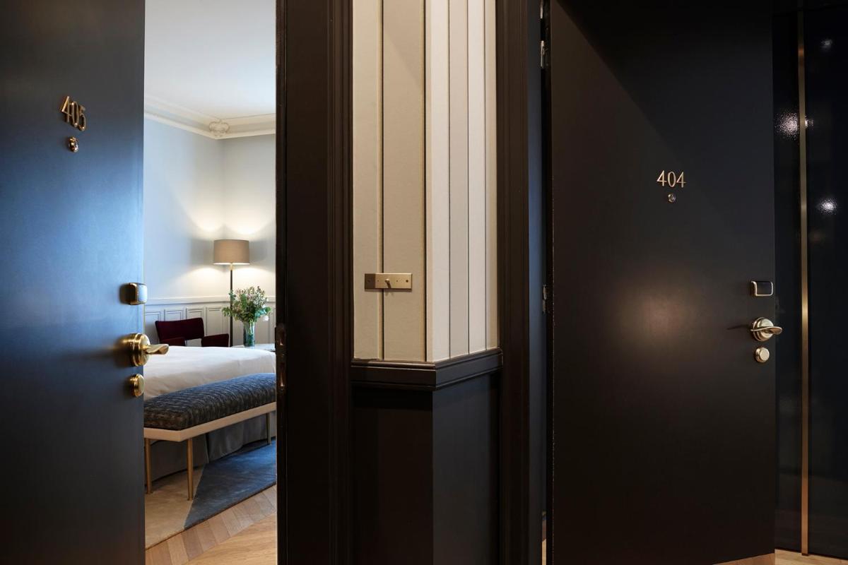 Un ou plusieurs lits dans un hébergement de l'établissement Grand Powers Hotel