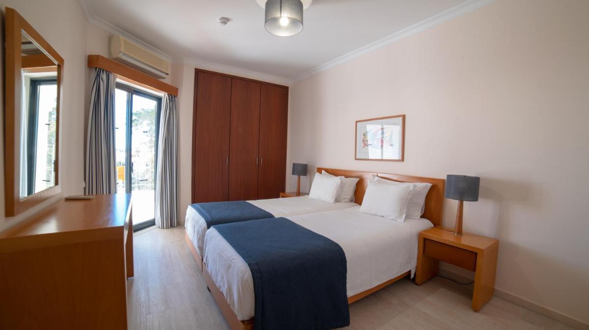 Uma cama ou camas num quarto em Vila Petra