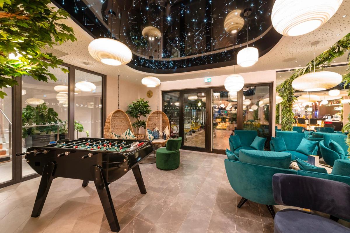 Coin salon dans l'établissement voco Strasbourg Centre - The Garden by IHG
