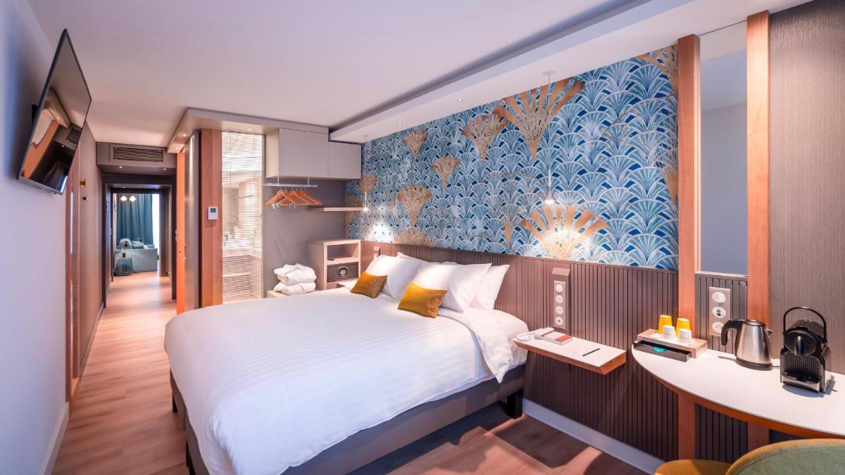 Un ou plusieurs lits dans un hébergement de l'établissement voco Strasbourg Centre - The Garden by IHG