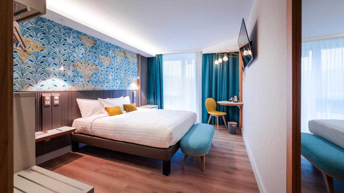Un ou plusieurs lits dans un hébergement de l'établissement voco Strasbourg Centre - The Garden by IHG