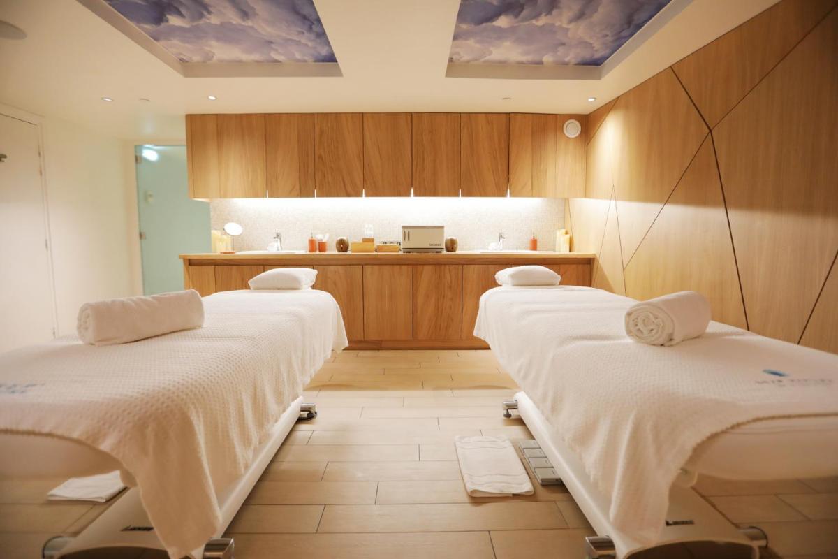 Cama o camas de una habitación en Center Parcs Villages Nature Paris