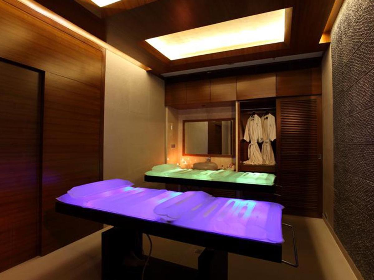 a bathroom with a sink and a mirror at The Lalit Mumbai in Mumbai