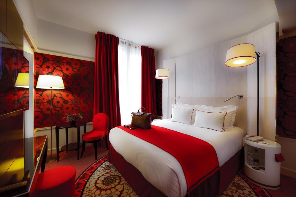 Un ou plusieurs lits dans un hébergement de l'établissement Carlton Hotel Lyon - MGallery Collection