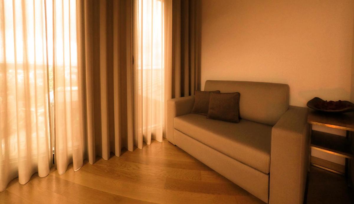 Uma área de estar em Castelo Hotel