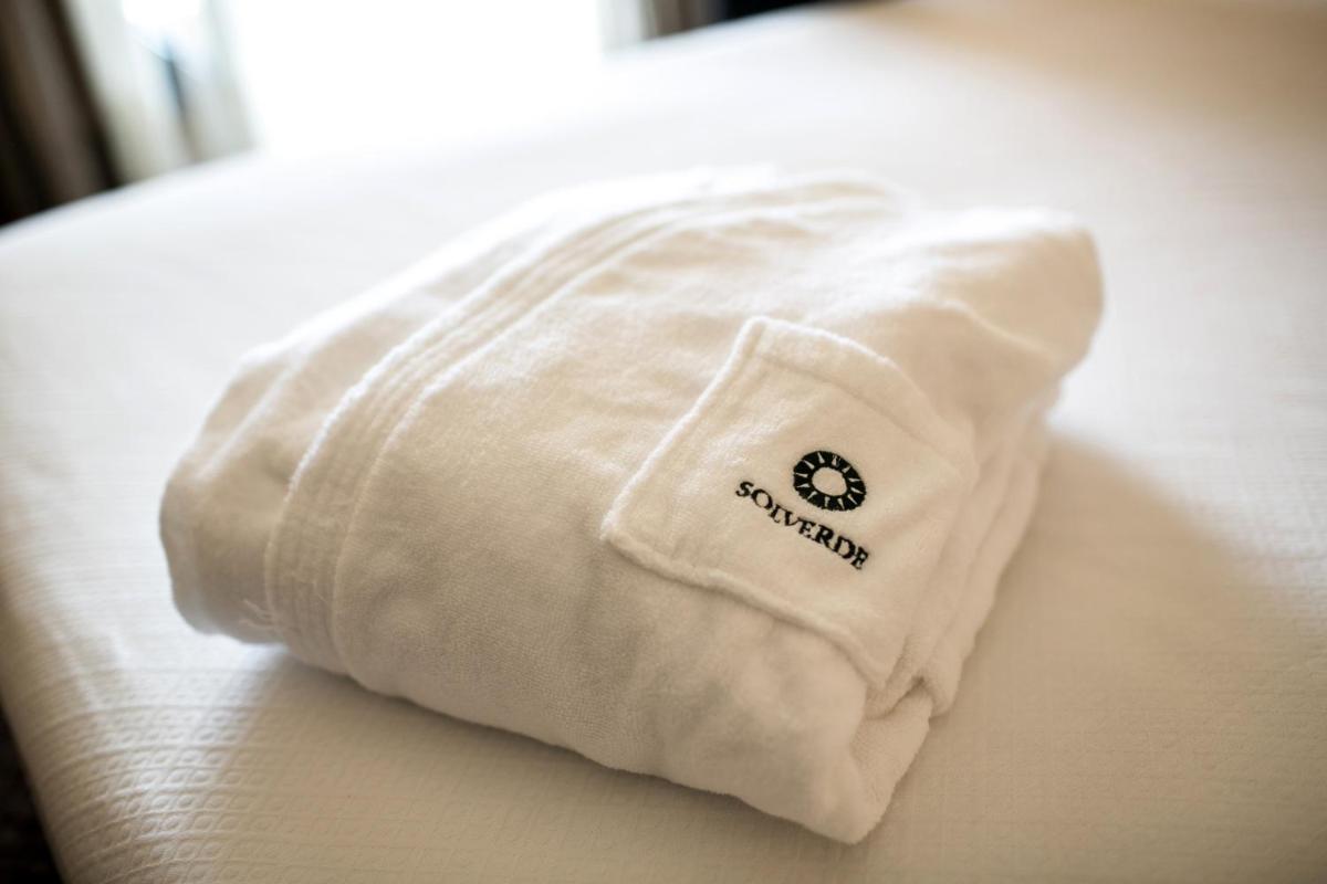 Uma cama ou camas num quarto em Hotel Solverde Spa and Wellness Center