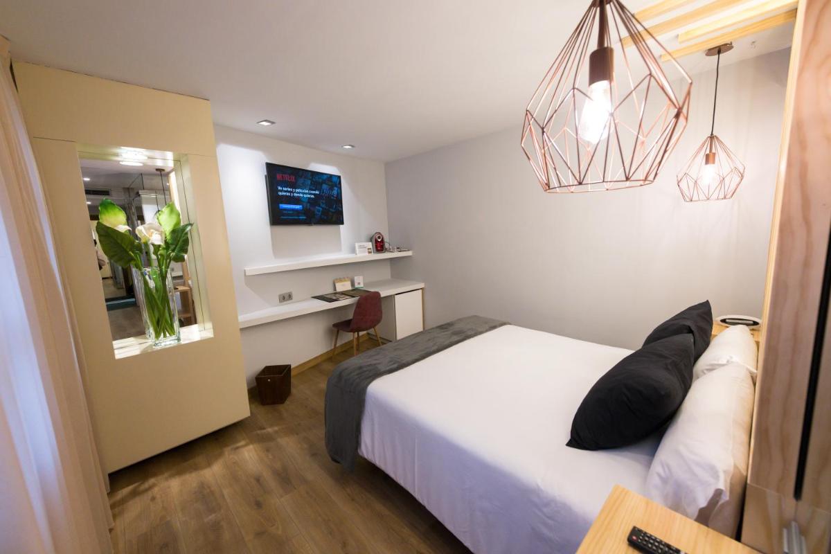 Cama o camas de una habitación en Hotel Fruela