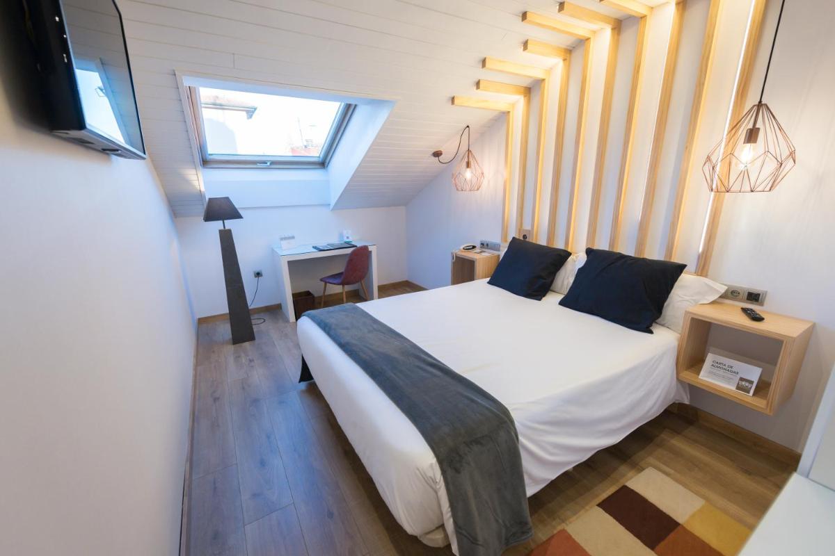 Cama o camas de una habitación en Hotel Fruela
