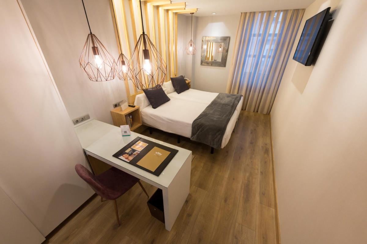 Cama o camas de una habitación en Hotel Fruela