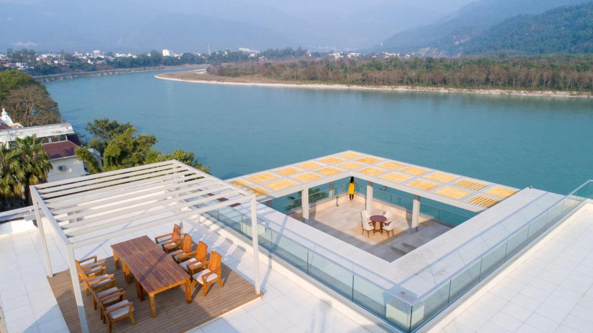 an aerial view of a house on top of a lake at Modi Yoga Retreat Rishikesh in Rishīkesh