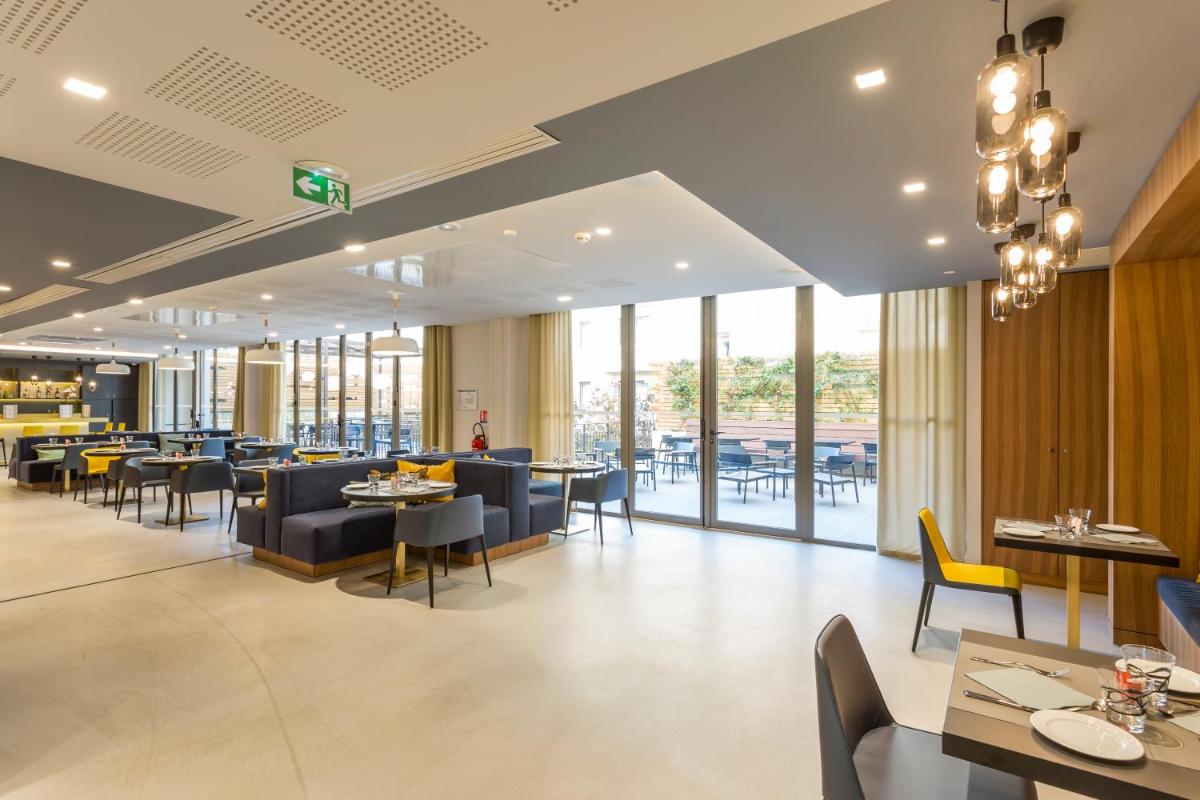 Coin salon dans l'établissement Nemea Appart Hotel Cannes Palais