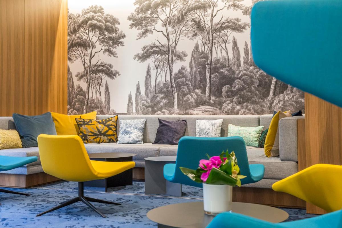Coin salon dans l'établissement Nemea Appart Hotel Cannes Palais