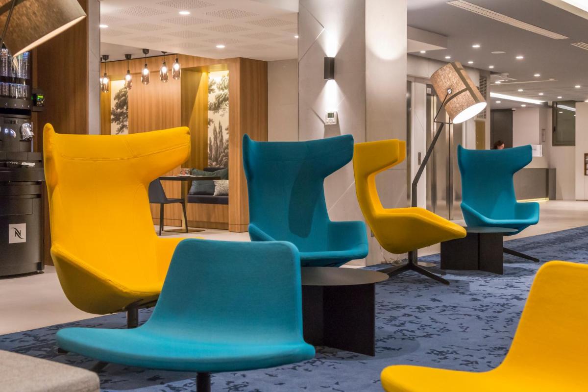 Coin salon dans l'établissement Nemea Appart Hotel Cannes Palais