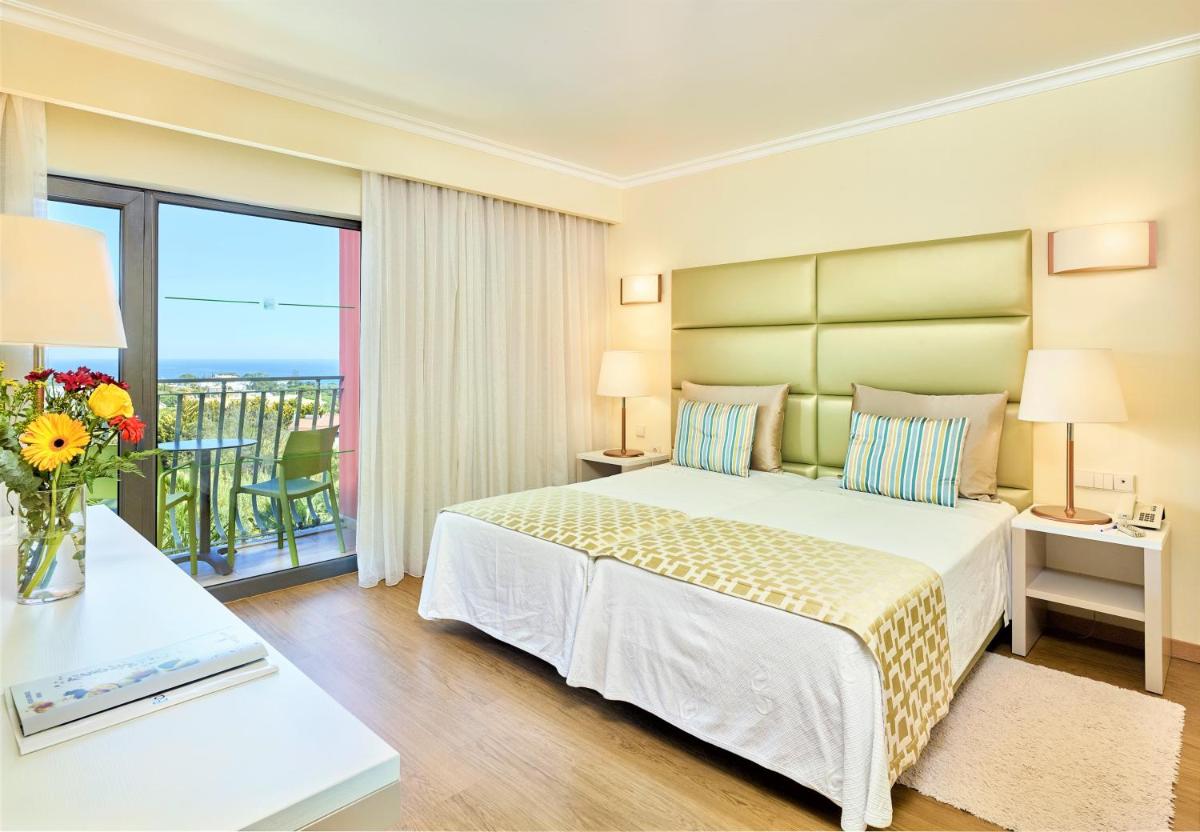 Uma cama ou camas num quarto em Hotel Baia Grande