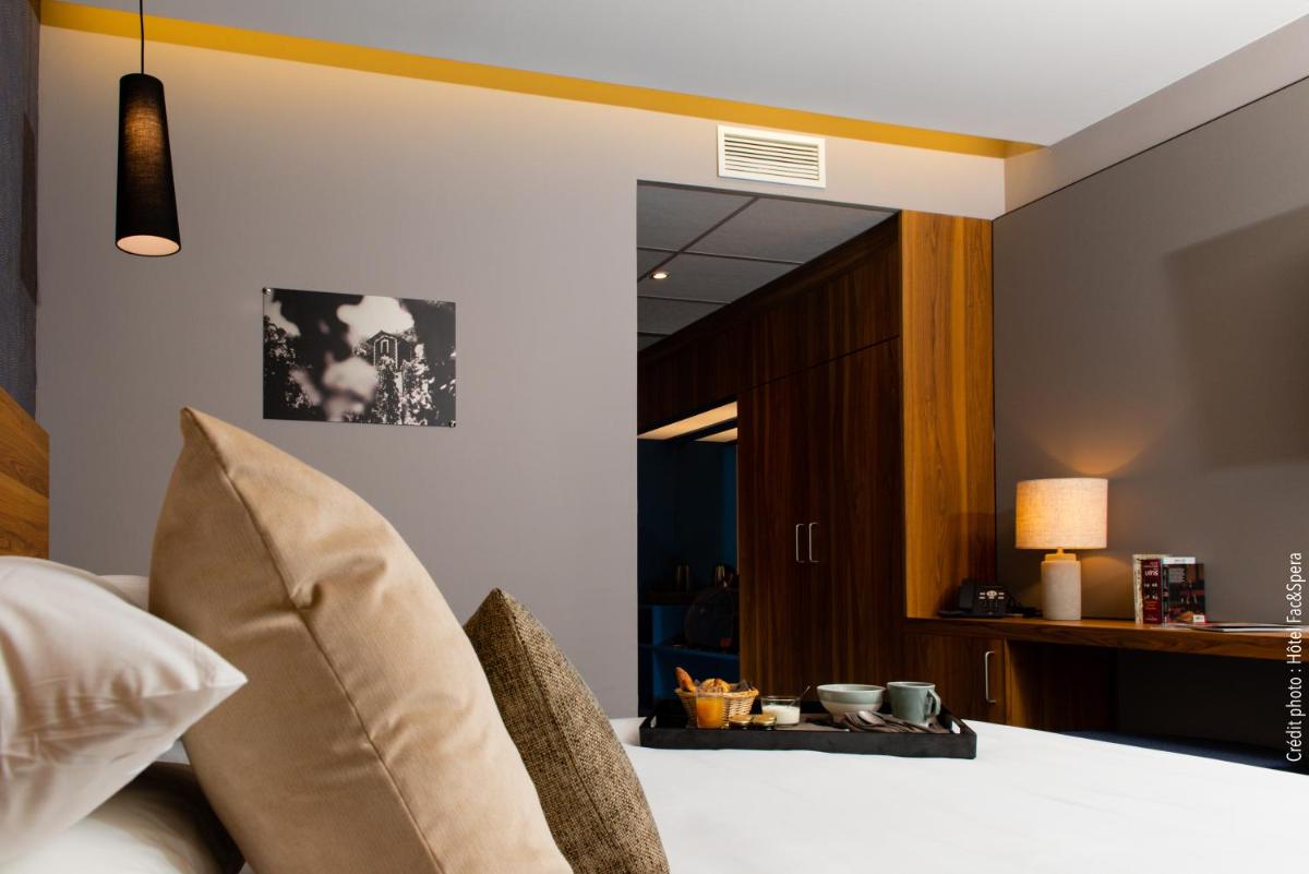 Un ou plusieurs lits dans un hébergement de l'établissement Fac & Spera -Hôtel & Spa