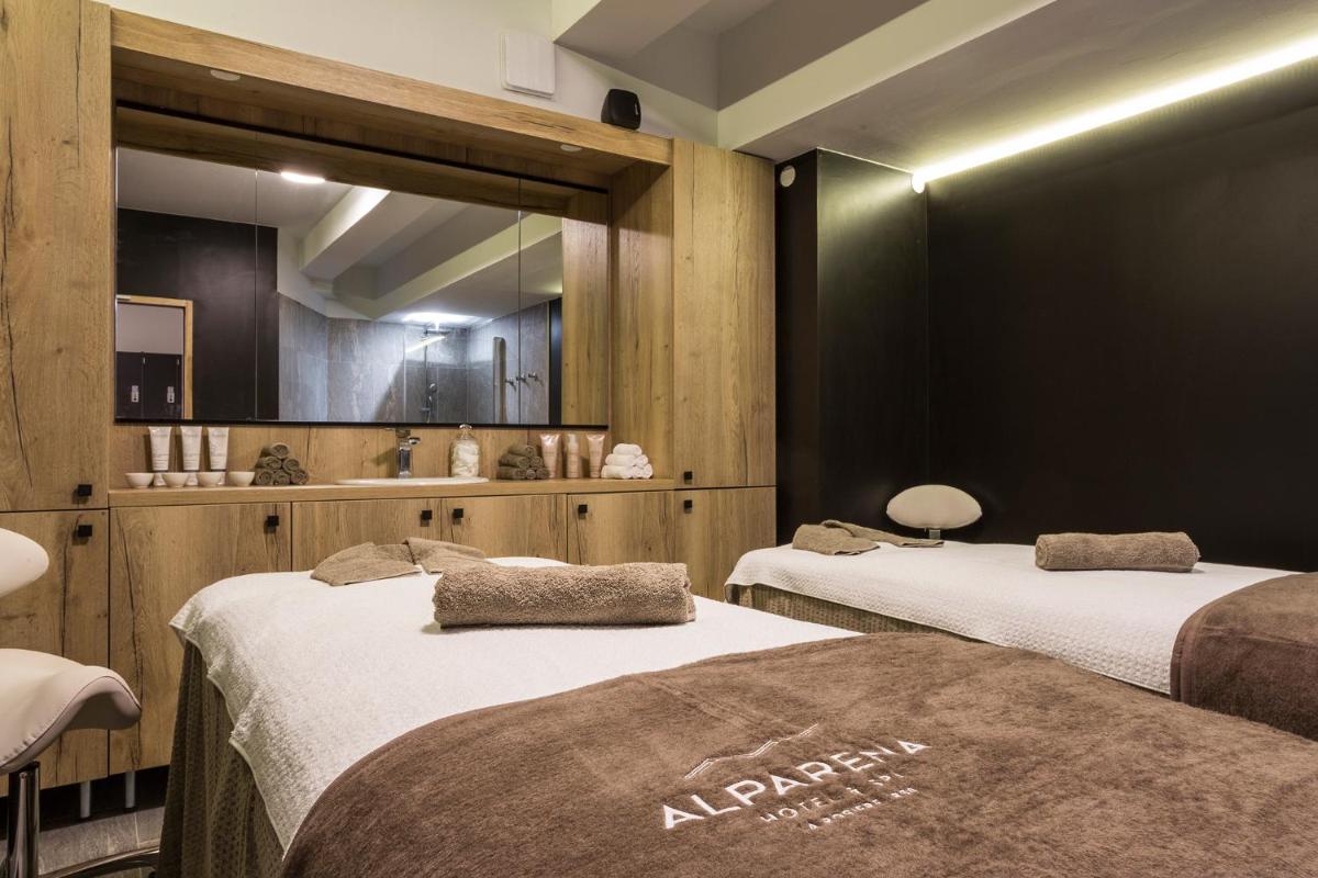 Un ou plusieurs lits dans un hébergement de l'établissement Hôtel Alparena & Spa - 4 étoiles