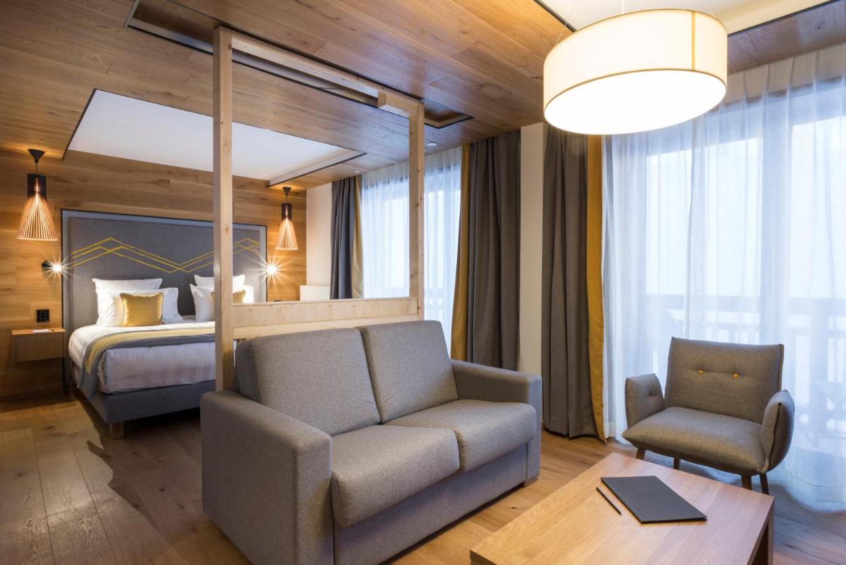 Un ou plusieurs lits dans un hébergement de l'établissement Hôtel Alparena & Spa - 4 étoiles