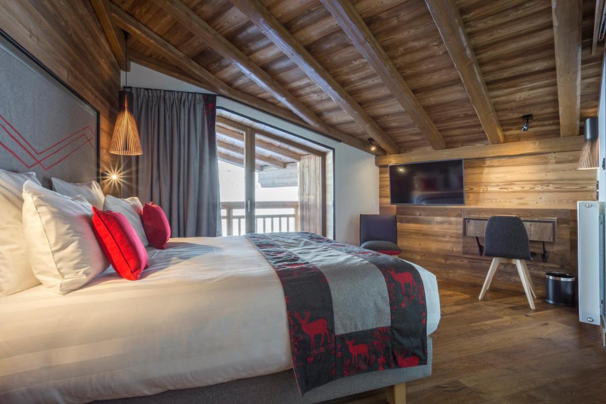 Un ou plusieurs lits dans un hébergement de l'établissement Hôtel Alparena & Spa - 4 étoiles